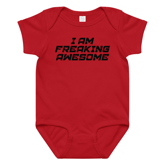 "I Am Freaking Awesome" printed on a red baby jersey bodysuit laying on a flat surface amongst other clothes