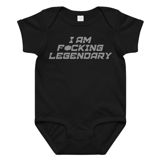 "I Am F*cking Legendary" printed on a black baby jersey bodysuit laying on a flat surface amongst other clothes