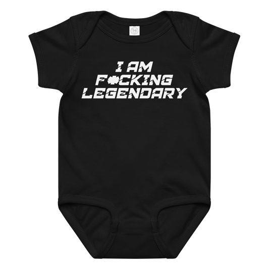 "I Am F*cking Legendary" printed on a black baby jersey bodysuit laying on a flat surface amongst other clothes