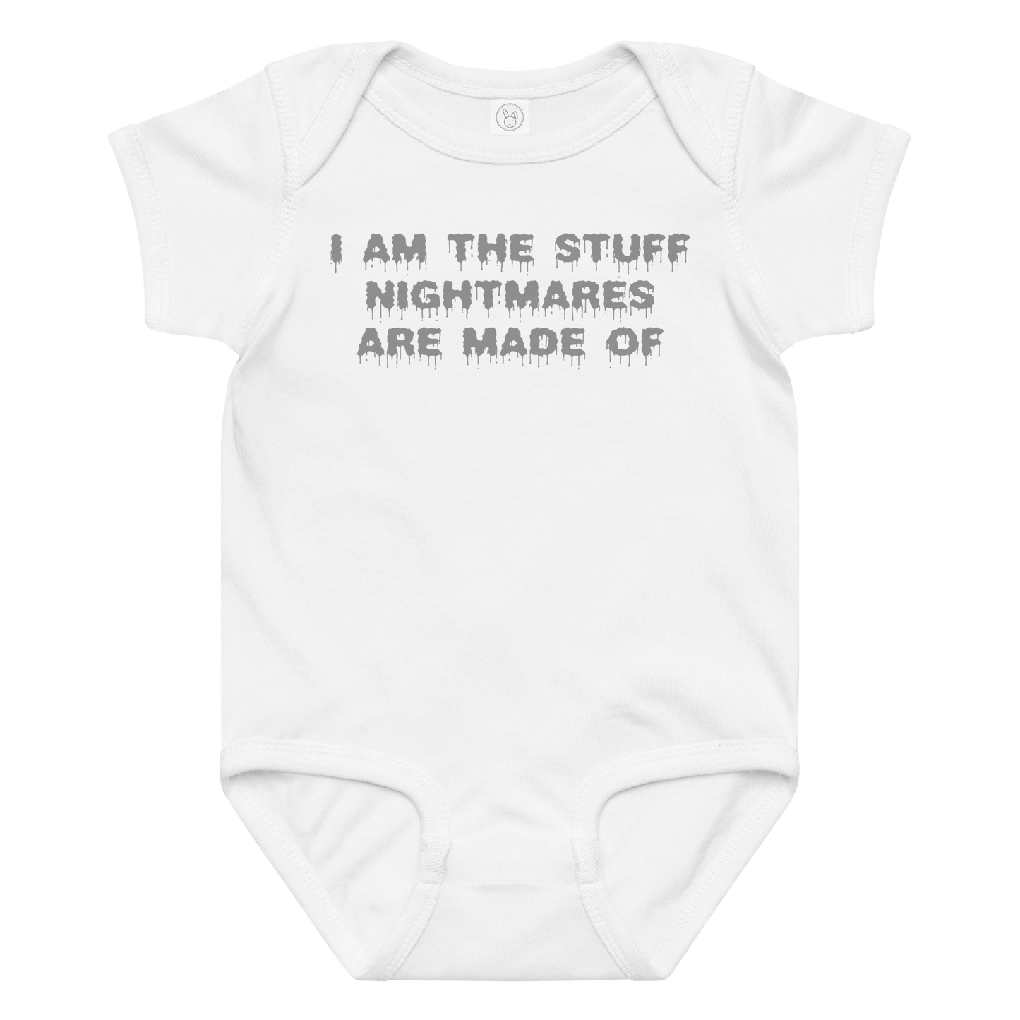 "I am the stuff nightmares are made of" printed on a white baby jersey bodysuit laying on a flat surface amongst other clothes