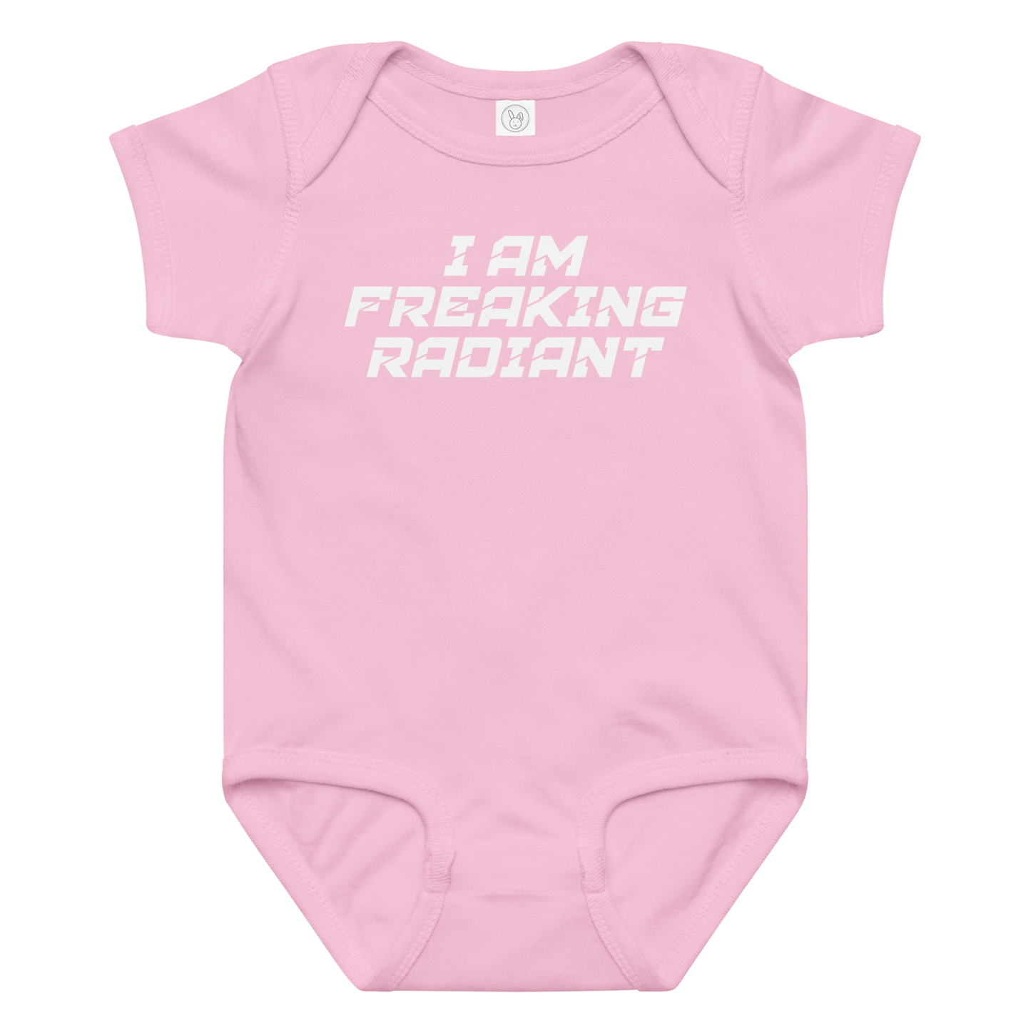 "I Am Freaking Radiant" printed on a pink baby jersey bodysuit laying on a flat surface amongst other clothes