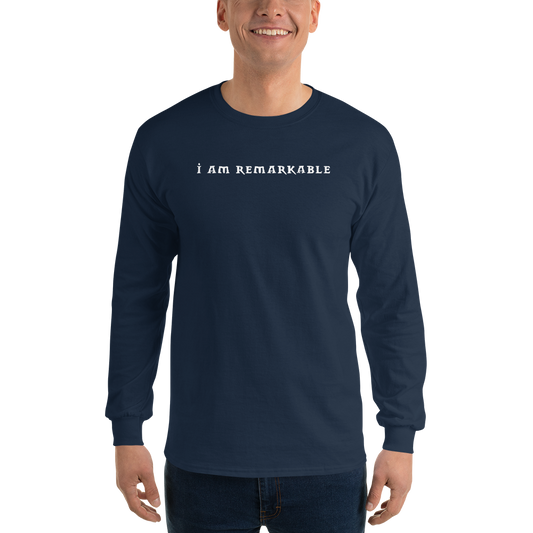"I am remarkable" printed on a navy men's long sleeve shirt worn by a male