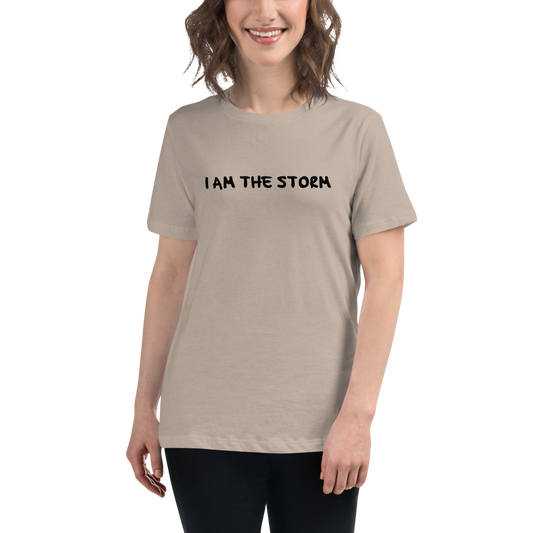 "I am the storm" printed on a heather stone women's relaxed t-shirt worn by a female