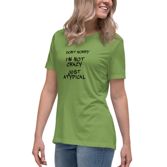 "Don't Worry I'm Not Crazy Just Atypical" printed on a leaf women's relaxed t-shirt worn by a female