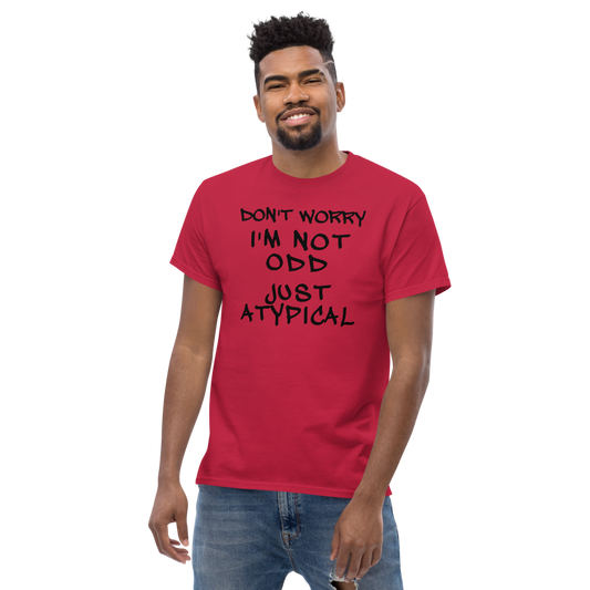 "Don't Worry I'm Not Odd Just Atypical" printed on a cardinal unisex classic tee worn by a male