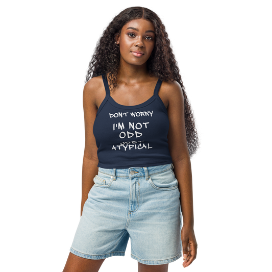 "Don't Worry I'm Not Odd Just Atypical" printed on a solid navy blend women's micro-rib tanktop worn by a female