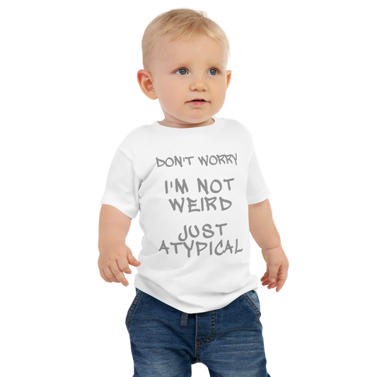 "Don't Worry I'm Not Weird Just Atypical" printed on a white baby jersey short sleeve tee worn by a male
