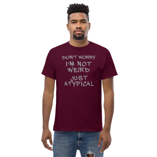 "Don't Worry I'm Not Weird Just Atypical" printed on a maroon unisex classic tee worn by a male