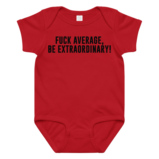 "Fuck Average, Be Extraordinary!" printed on a red baby jersey bodysuit laying on a flat surface amongst other clothes
