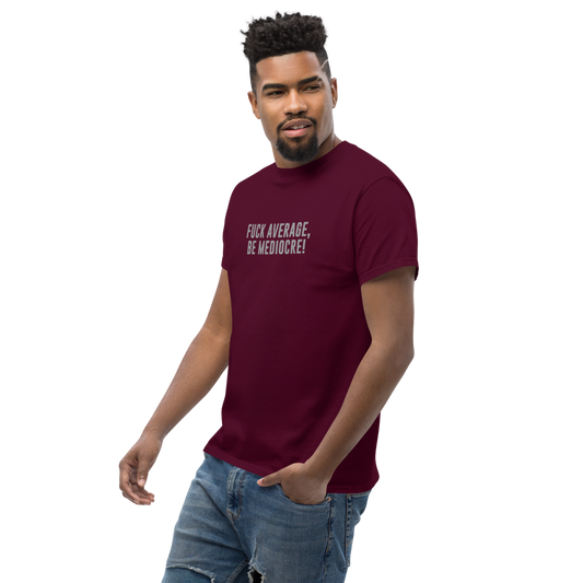 "Fuck Average, Be Mediocre!" printed on a maroon unisex classic tee worn by a male