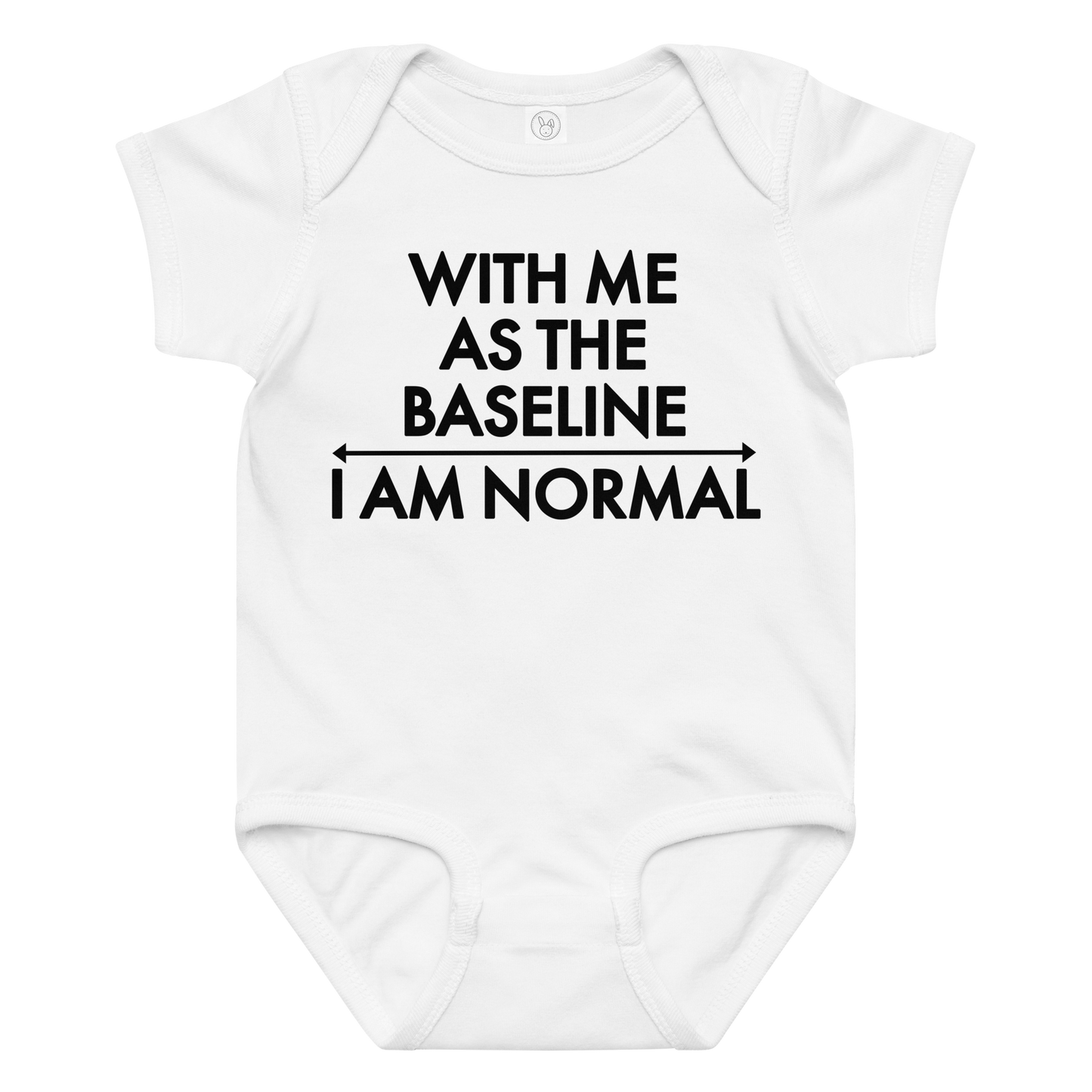 "With me as the baseline, I am normal" printed on a white baby jersey bodysuit laying on a flat surface amongst other clothes