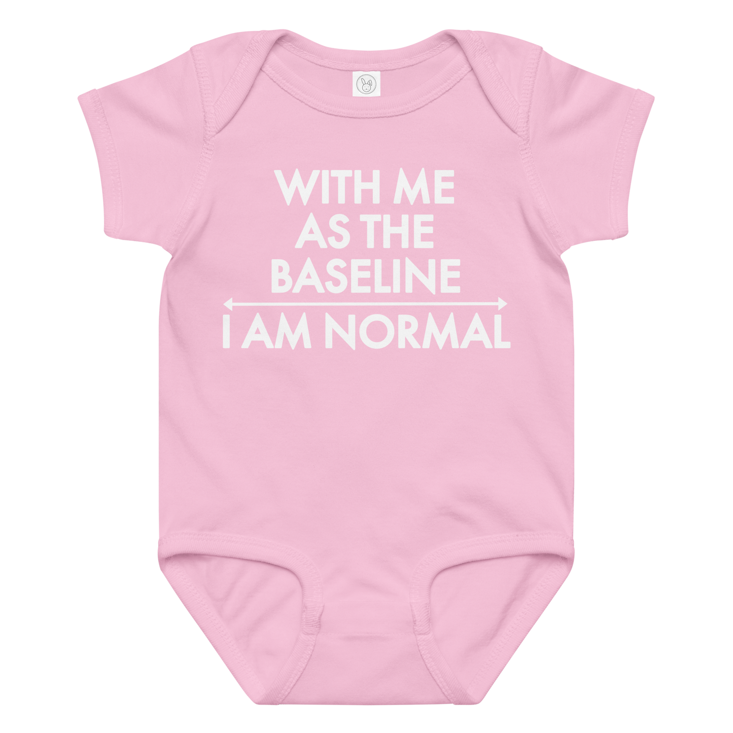 "With me as the baseline, I am normal" printed on a pink baby jersey bodysuit laying on a flat surface amongst other clothes