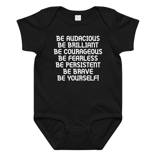 "Be Audacious Be Brilliant Be Courageous Be Fearless Be Persistent Be Brave Be Yourself!" printed on a black baby jersey bodysuit laying on a flat surface amongst other clothes