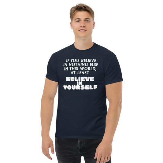 "If you believe in nothing else in this world, at least believe in yourself" printed on a navy unisex classic tee worn by a male