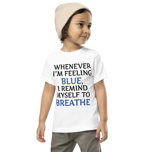 "Whenever I'm feeling blue, I remind myself to breathe" printed on a white toddler short sleeve tee worn by a male wearing a cap