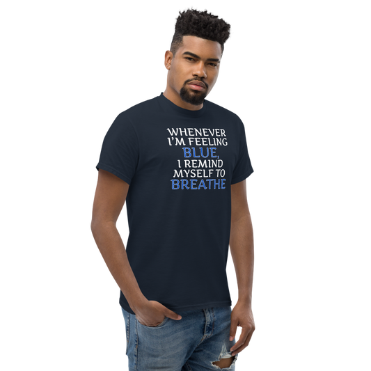 "Whenever I'm feeling blue, I remind myself to breathe" printed on a navy unisex classic tee worn by a male