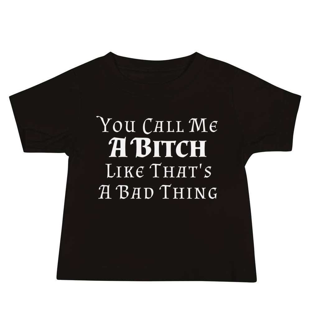 "You Call Me A Bitch Like That's A Bad Thing" printed on a black baby jersey short sleeve tee laying on a flat surface