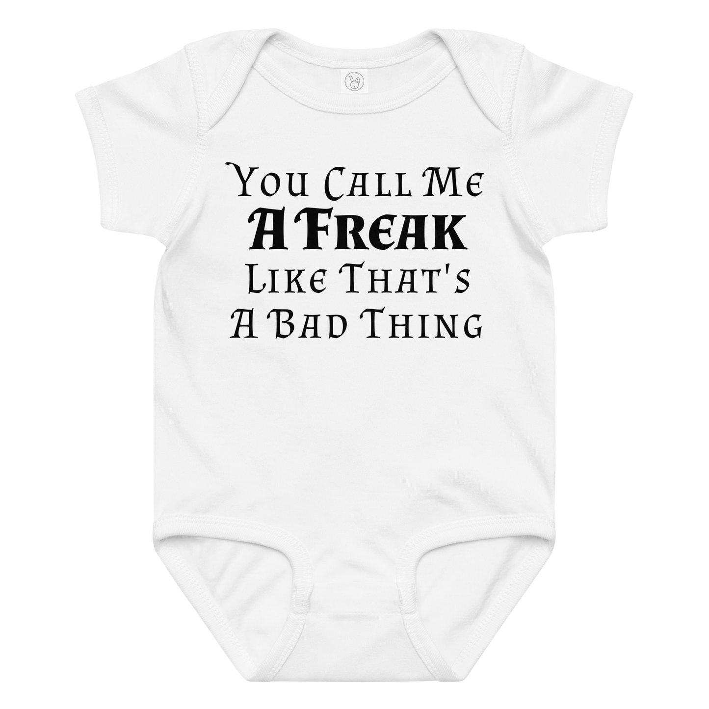 "You Call Me A Freak Like That's A Bad Thing" printed on a white baby jersey bodysuit laying on a flat surface amongst other clothes