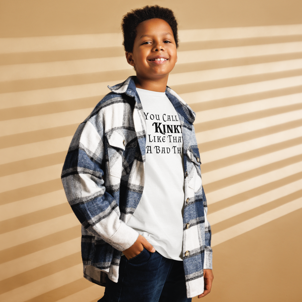 "You Call Me Kinky Like That's A Bad Thing" printed on a white youth classic tee worn by a male also wearing a jacket