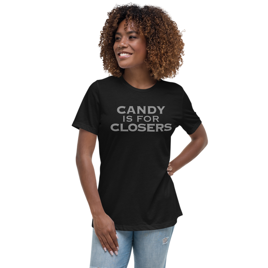 "Candy Is For Closers" printed on a black women's relaxed t-shirt worn by a female