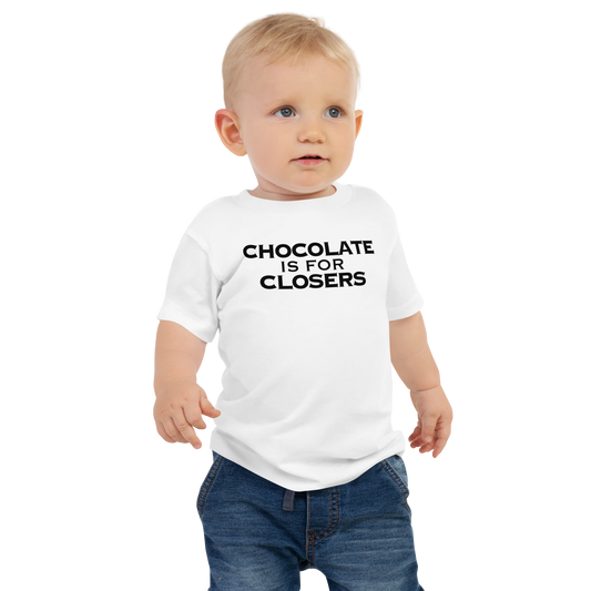 "Chocolate Is For Closers" printed on a white baby jersey short sleeve tee worn by a male