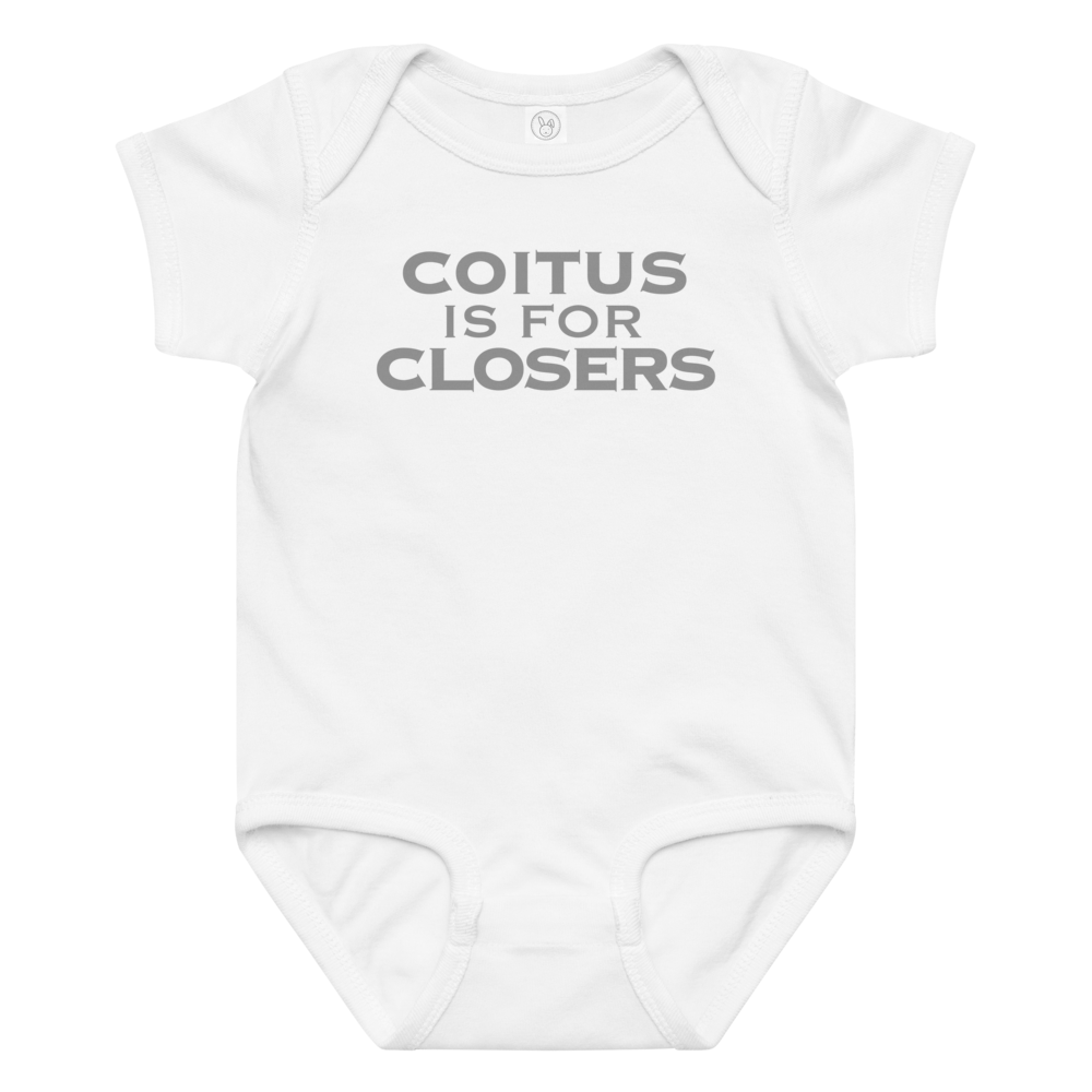 "Coitus Is For Closers" printed on a white baby jersey bodysuit laying on a flat surface amongst other clothes