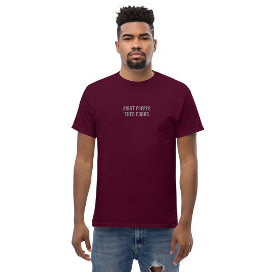 "First Coffee Then Chaos" printed on a maroon unisex classic tee worn by a male