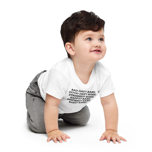 "Bad Day? Bake. Good Day? Bake. Stressed? Bake. Happy? Bake. Inspired? Bake. Bake? Bake!" printed on a white baby jersey short sleeve tee worn by a male who is crawling