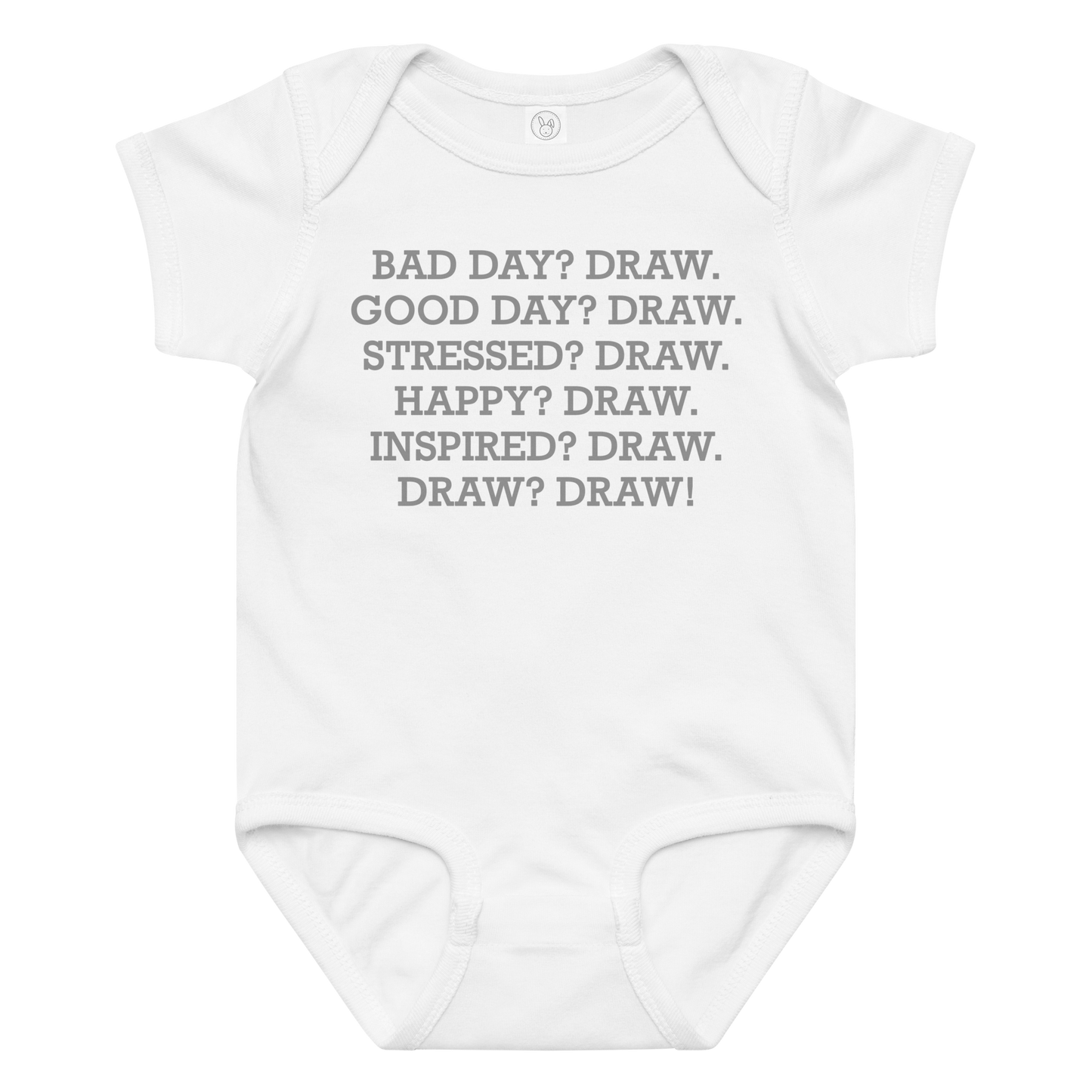 "Bad Day? Draw. Good Day? Draw. Stressed? Draw. Happy? Draw. Inspired? Draw. Draw? Draw!" printed on a white baby jersey bodysuit laying on a flat surface amongst other clothes