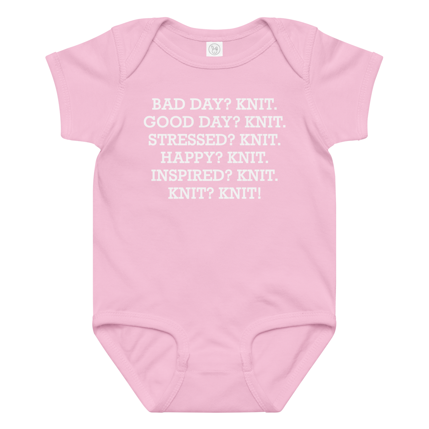 "Bad Day? Knit. Good Day? Knit. Stressed? Knit. Happy? Knit. Inspired? Knit. Knit? Knit!" printed on a pink baby jersey bodysuit laying on a flat surface amongst other clothes