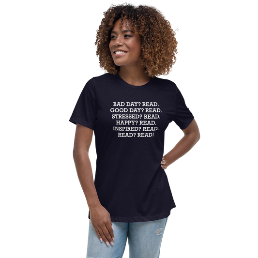 "Bad Day? Read. Good Day? Read. Stressed? Read. Happy? Read. Inspired? Read. Read? Read!" printed on a navy women's relaxed t-shirt worn by a female