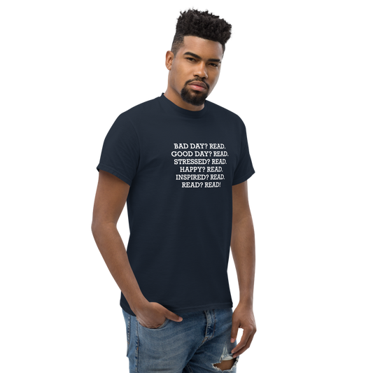 "Bad Day? Read. Good Day? Read. Stressed? Read. Happy? Read. Inspired? Read. Read? Read!" printed on a navy unisex classic tee worn by a male