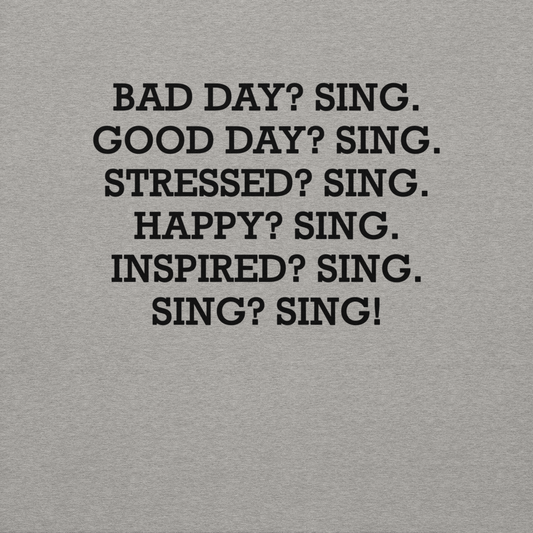 "Bad Day? Sing. Good Day? Sing. Stressed? Sing. Happy? Sing. Inspired? Sing. Sing? Sing!" printed on a carbon grey background