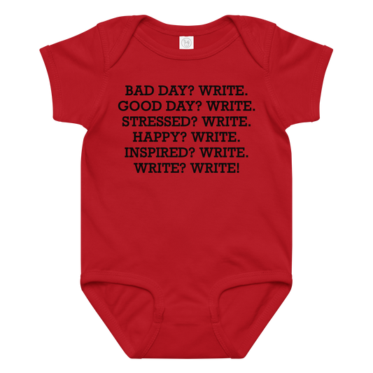 "Bad Day? Write. Good Day? Write. Stressed? Write. Happy? Write. Inspired? Write. Write? Write!" printed on a red baby jersey bodysuit laying on a flat surface amongst other clothes