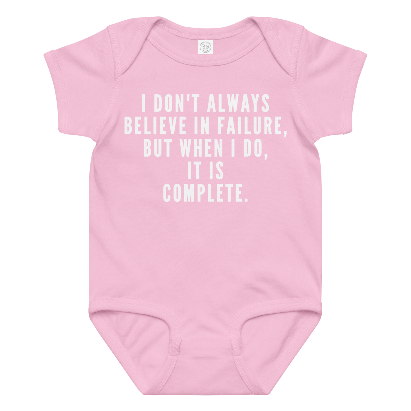 "I don't always believe in failure, but when I do, it is complete." printed on a pink baby jersey bodysuit laying on a flat surface amongst other clothes