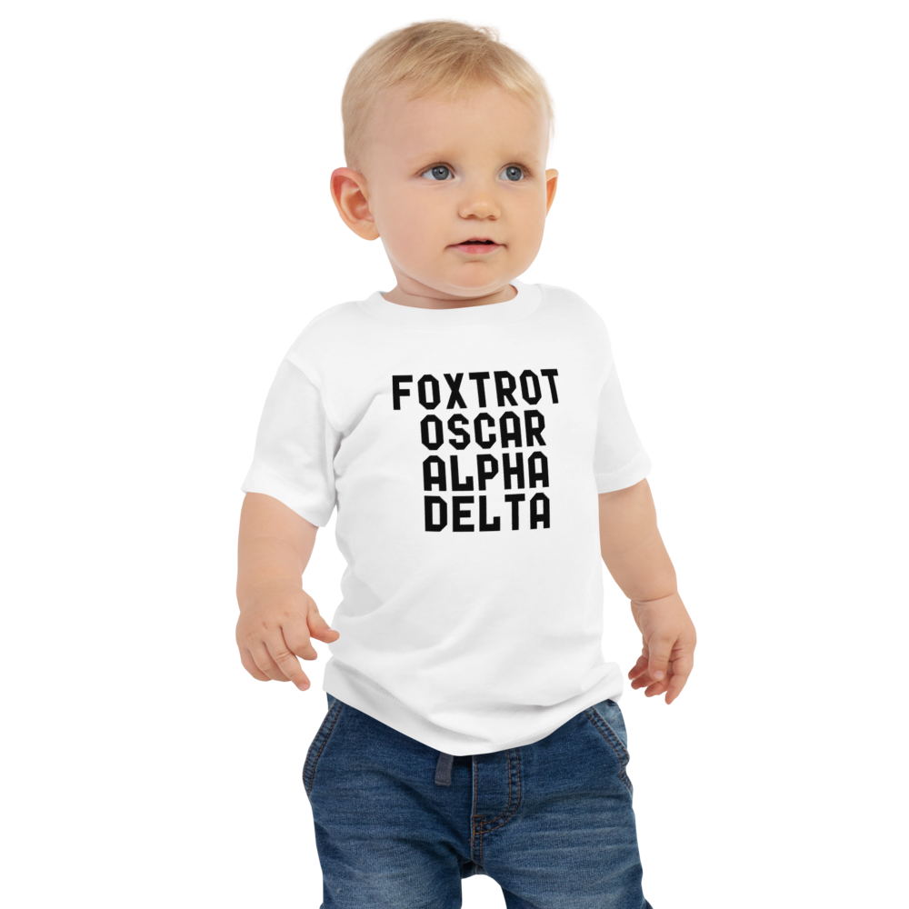 "Foxtrot Oscar Alpha Delta" printed on a white baby jersey short sleeve tee worn by a male