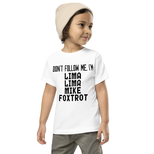 "Don’t follow me, I'm Lima Lima Mike Foxtrot" printed on a white toddler short sleeve tee worn by a male wearing a cap
