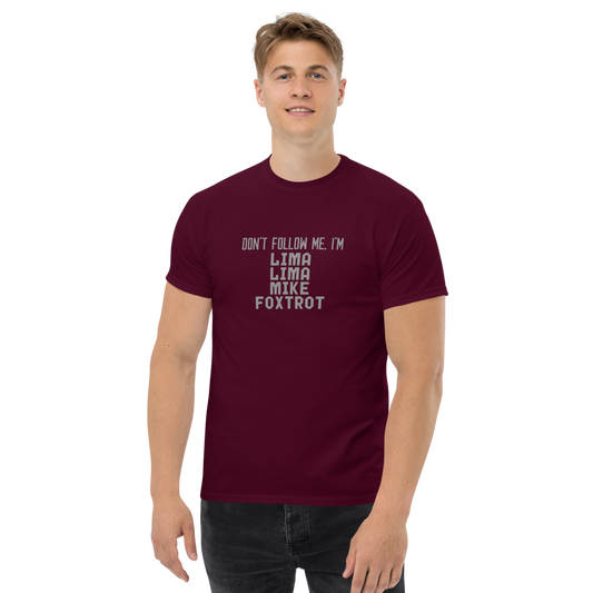 "Don’t follow me, I'm Lima Lima Mike Foxtrot" printed on a maroon unisex classic tee worn by a male