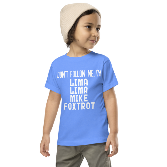 "Don’t follow me, I'm Lima Lima Mike Foxtrot" printed on a heather columbia blue toddler short sleeve tee worn by a male wearing a cap