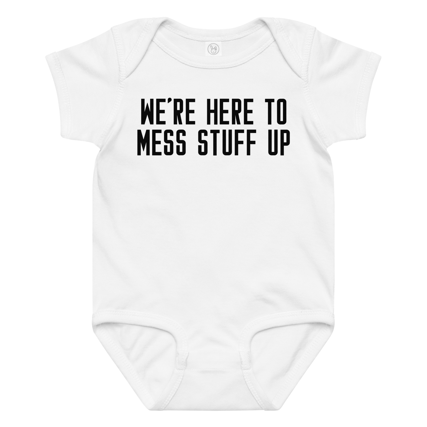 "We're Here To Mess Stuff Up" printed on a white baby jersey bodysuit laying on a flat surface amongst other clothes