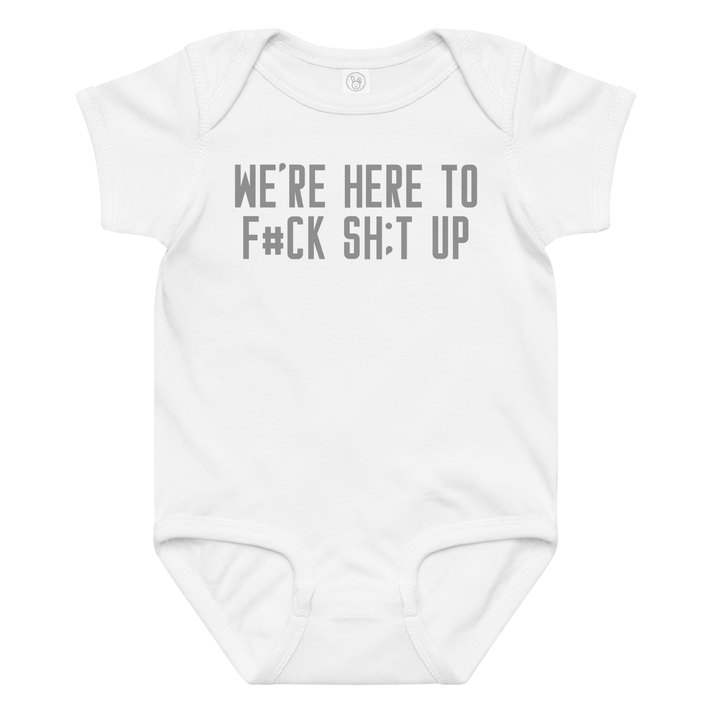"We're Here To F#Ck Sh:t Up" printed on a white baby jersey bodysuit laying on a flat surface amongst other clothes