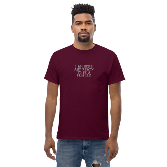 "I am here and ready to be a problem" printed on a maroon unisex classic tee worn by a male