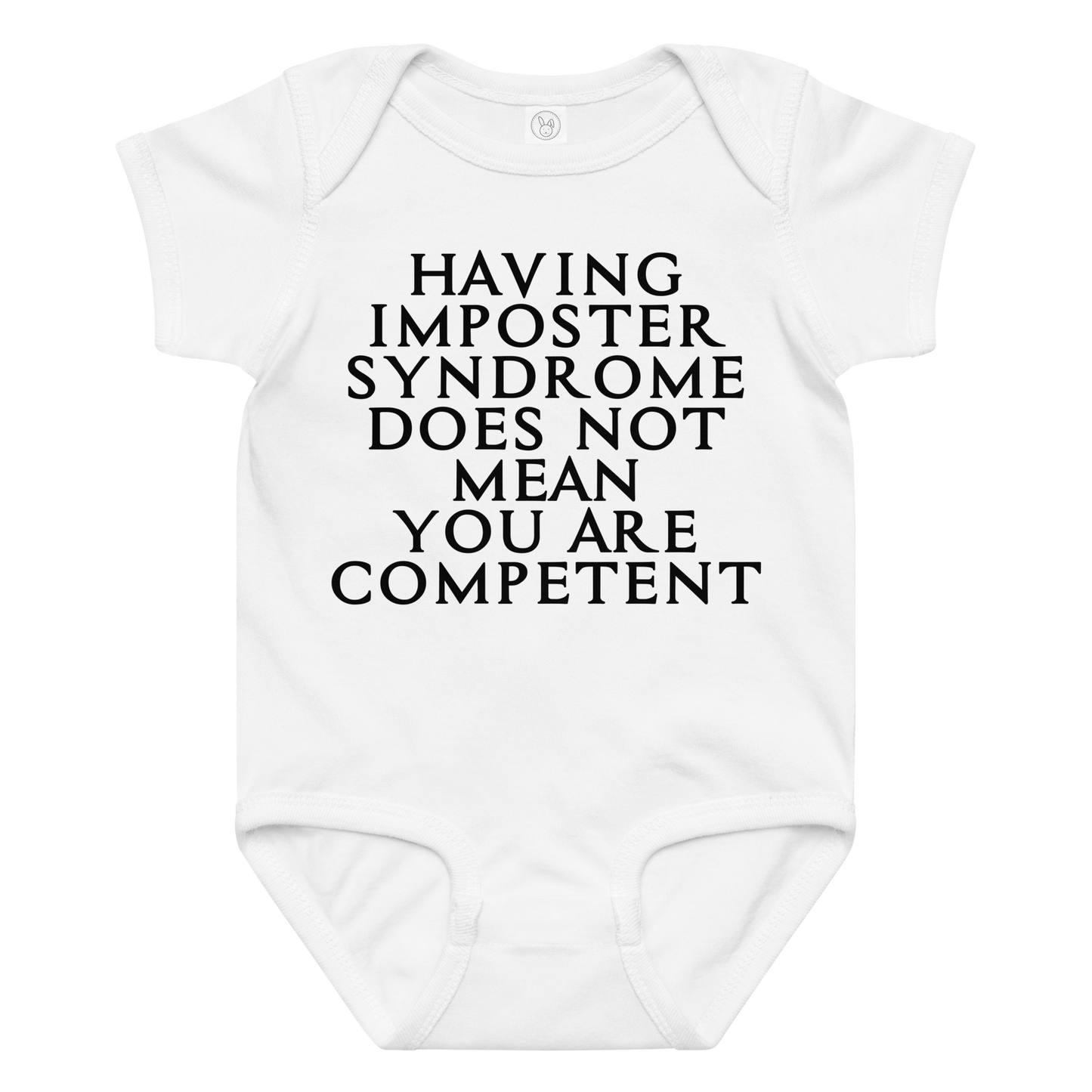 "Having Imposter Syndrome does not mean you are competent" printed on a white baby jersey bodysuit laying on a flat surface amongst other clothes