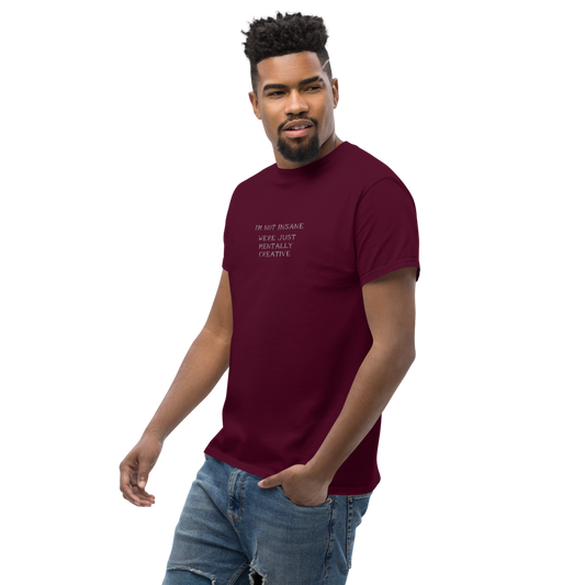 "I’m not insane We’re just mentally creative" printed on a maroon unisex classic tee worn by a male