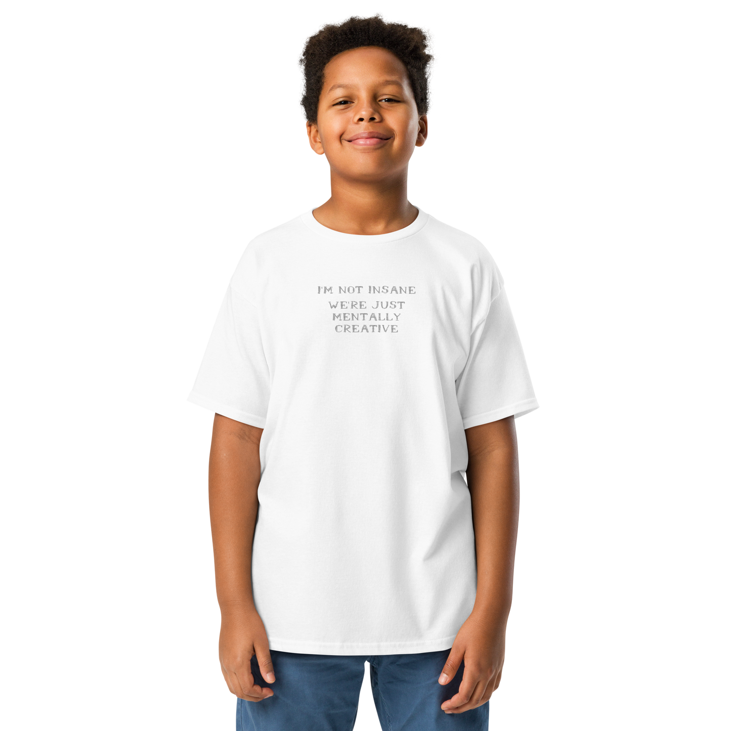 "I’m not insane We’re just mentally creative" printed on a white youth classic tee worn by a male