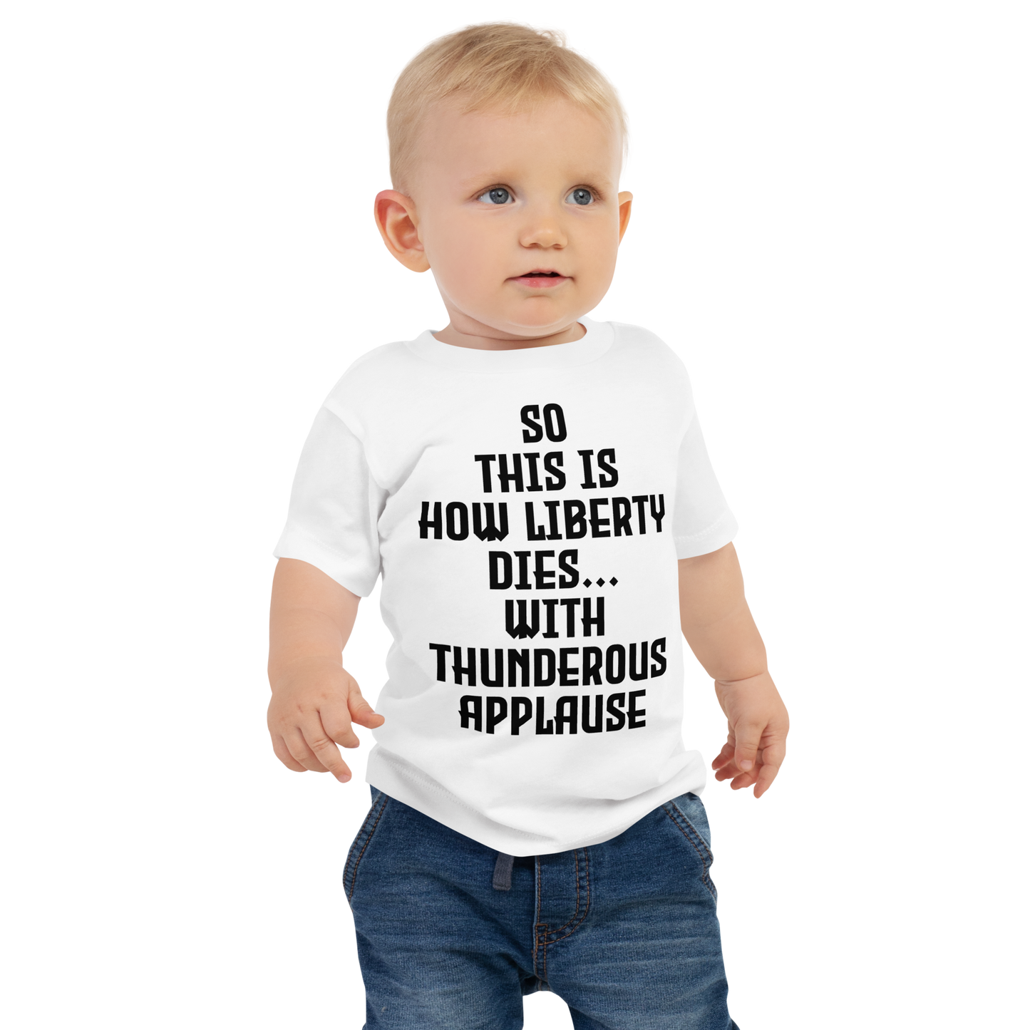 "So this is how liberty dies… with thunderous applause" printed on a white baby jersey short sleeve tee worn by a male