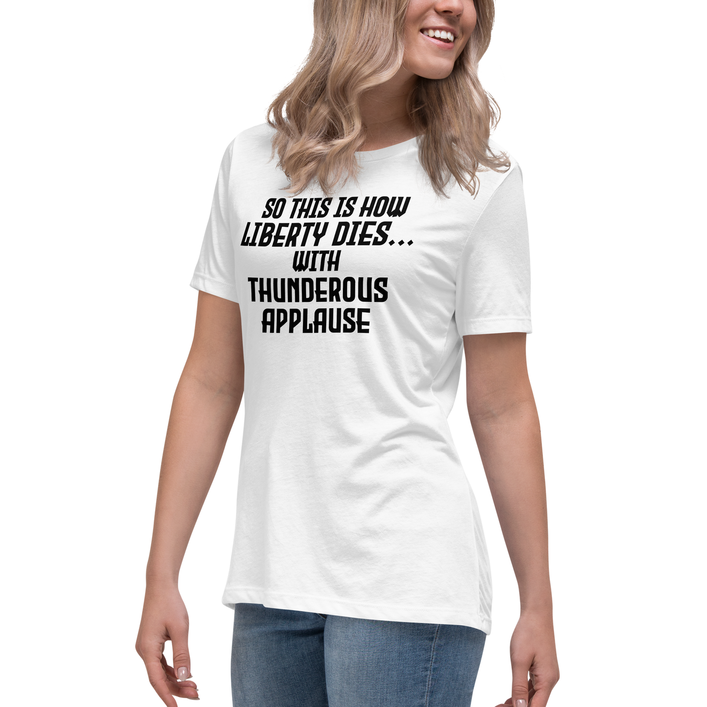 "So this is how liberty dies… with thunderous applause" printed on a white women's relaxed t-shirt worn by a female