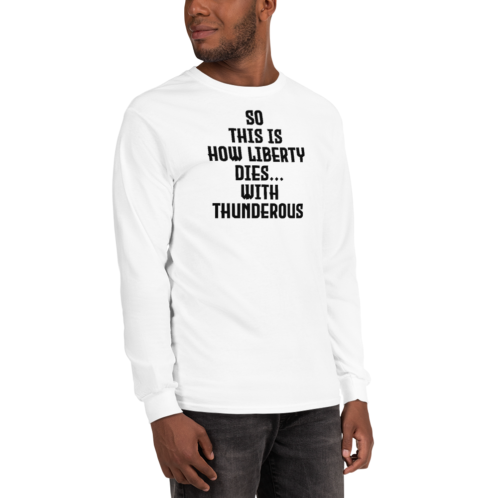 "So this is how liberty dies… with thunderous applause" printed on a white men's long sleeve shirt worn by a male