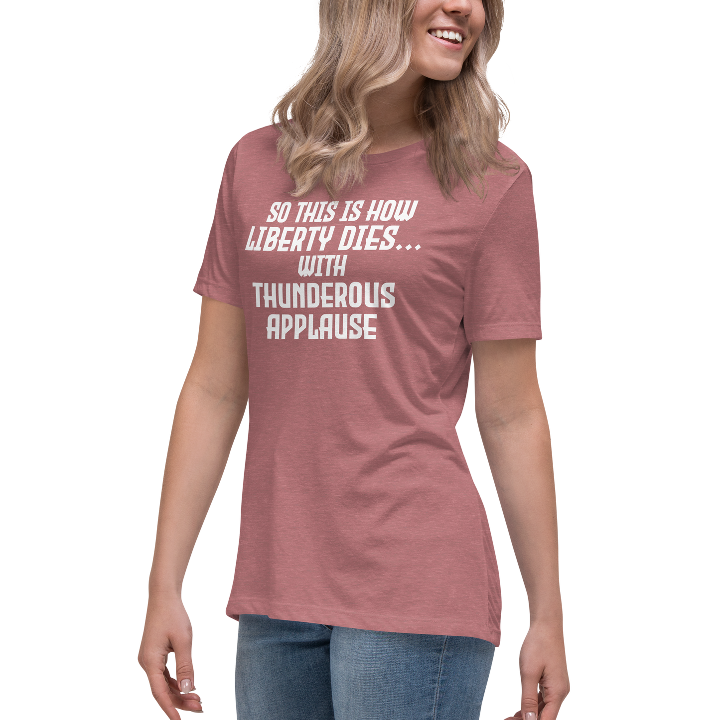 "So this is how liberty dies… with thunderous applause" printed on a heather mauve women's relaxed t-shirt worn by a female