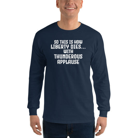 "So this is how liberty dies… with thunderous applause" printed on a navy men's long sleeve shirt worn by a male